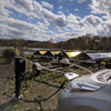 Leaf plugged in with adapter charging on solar power.