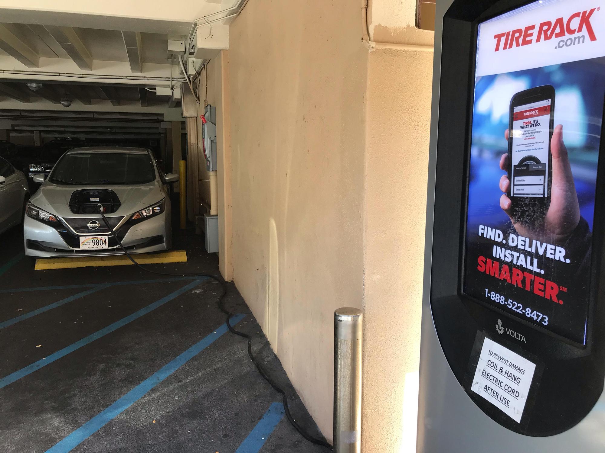It’s a long stretch for the cord and a tight fit parking in EV space 154, but it can be done.