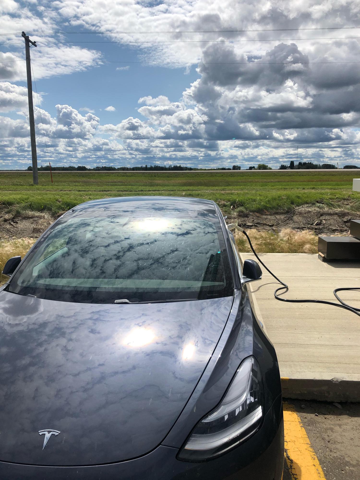 A beautiful day in High Prairie. Model 3 SR  charging at 7kw.
