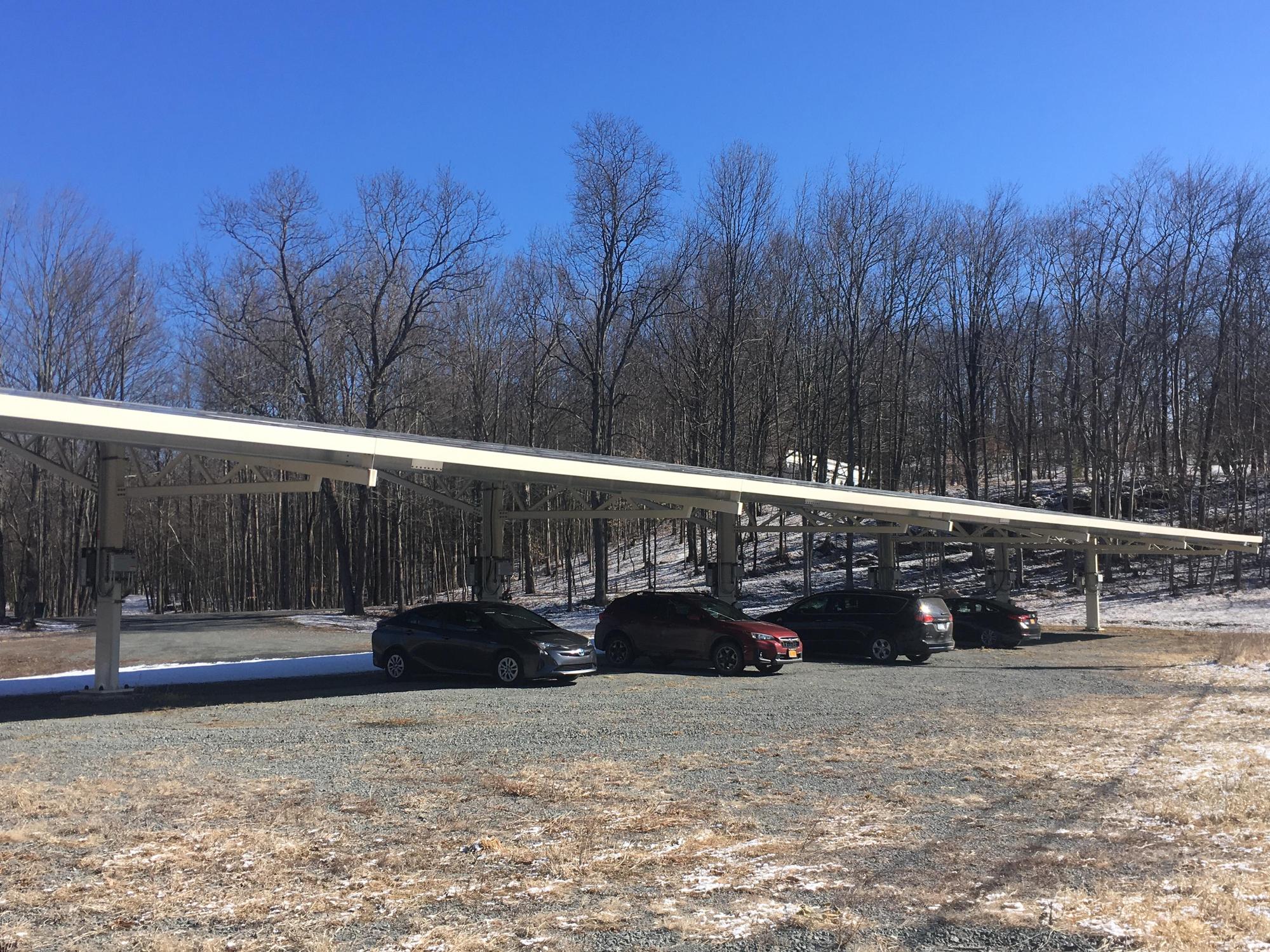 Two charging stations under the large solar array.