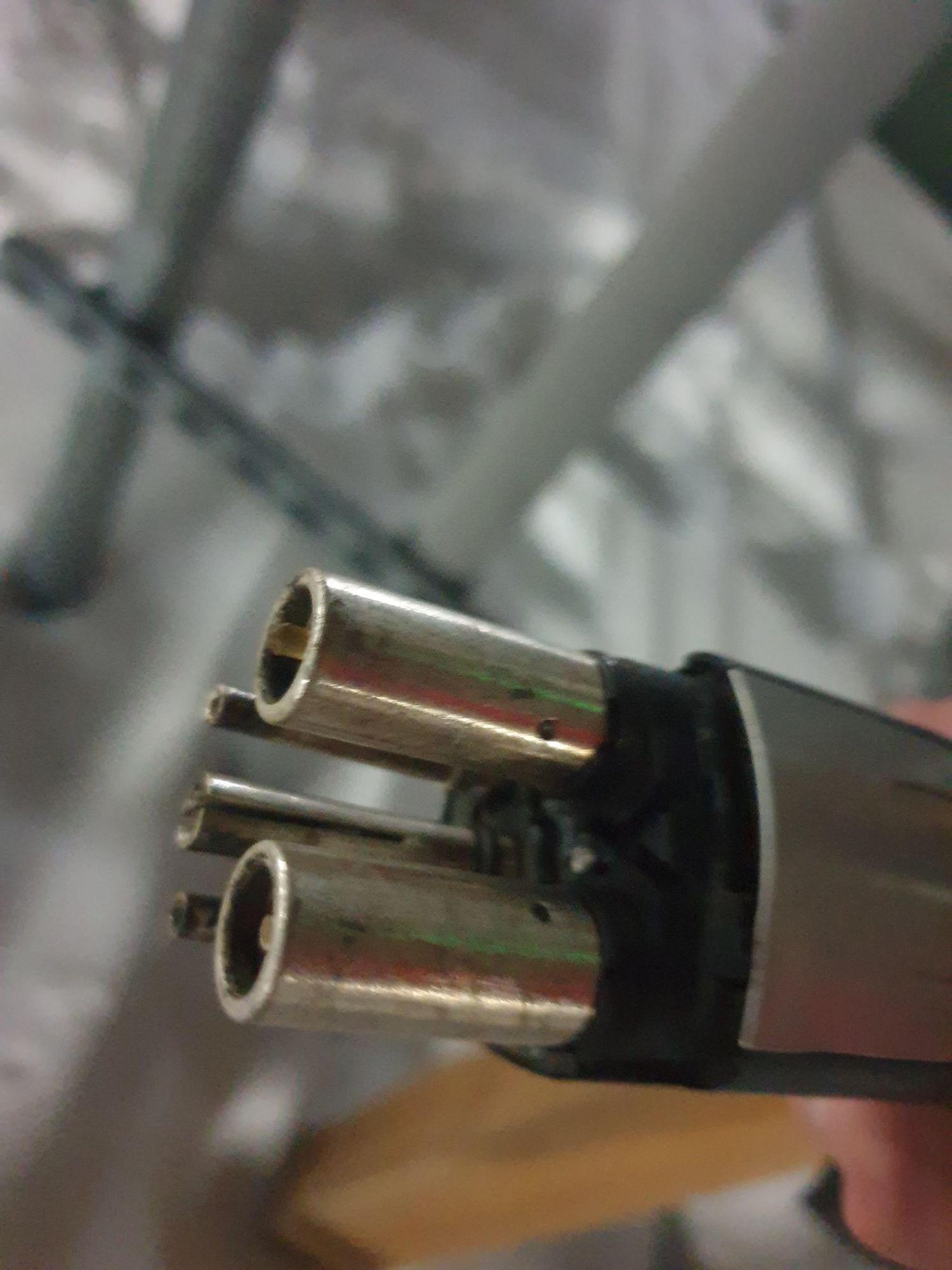 Exposed contacts on middle Tesla charger as of 12/22.
