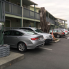 Tesla charger located further down the parking lot