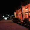 Closest to a power cabinet is next to the restoran. Speak with manager to allow you to charge and pursuade him you would drow not too much power ;)