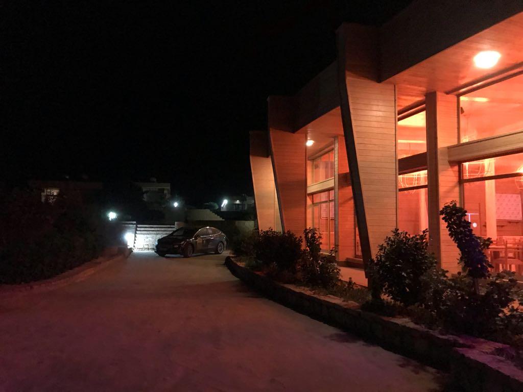 Closest to a power cabinet is next to the restoran. Speak with manager to allow you to charge and pursuade him you would drow not too much power ;)