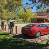 Chargers on the left, as you enter the driveway.  Office is the building beyond the car.