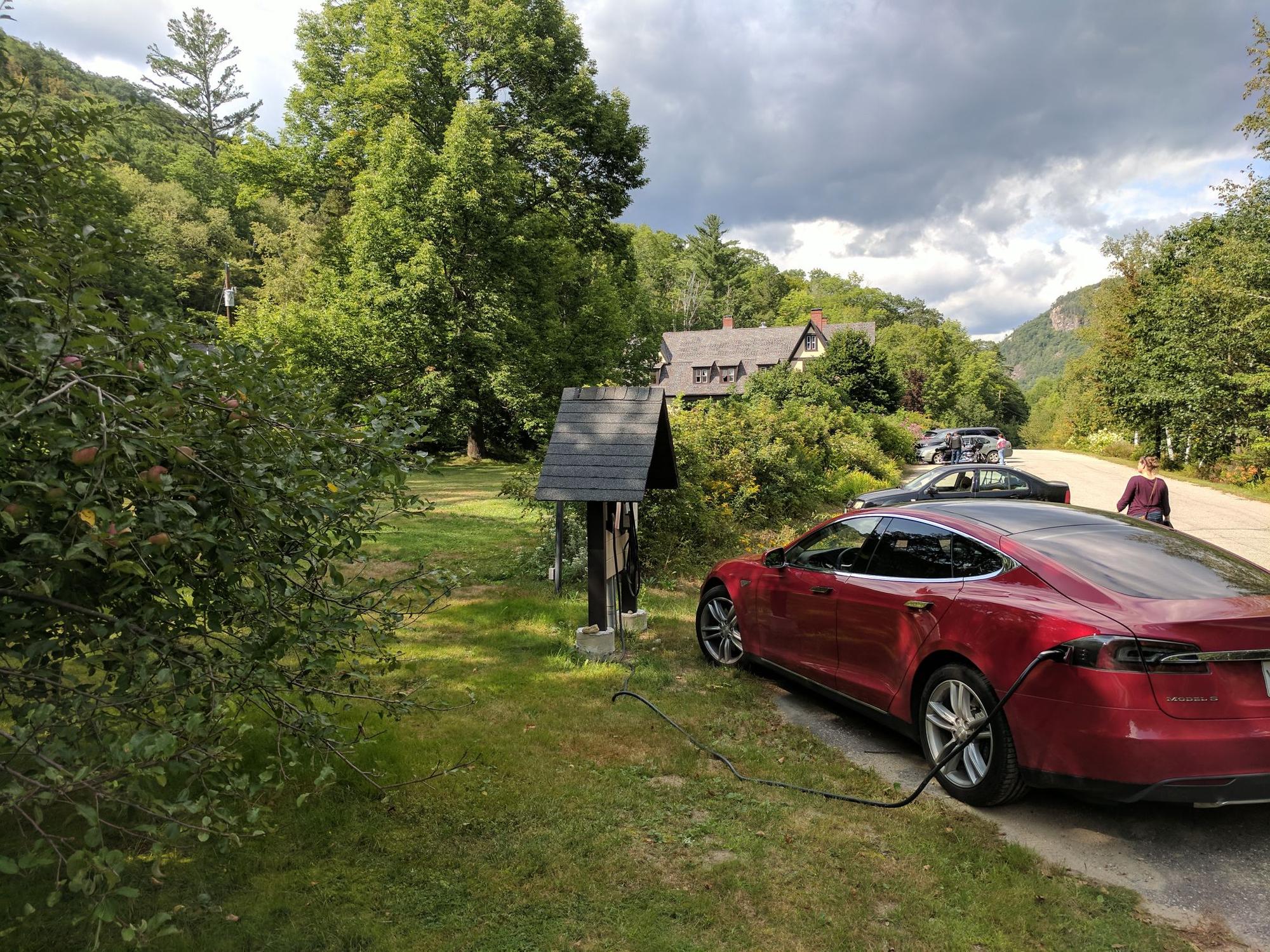 On the other side of the parking .  Got 64 amps @ 238V from the Tesla wall connector