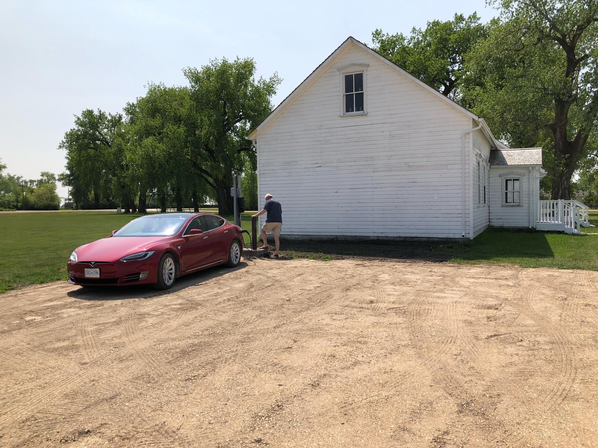 Charging our Tesla at the Neubergthal  Commons in Southern Manitoba.